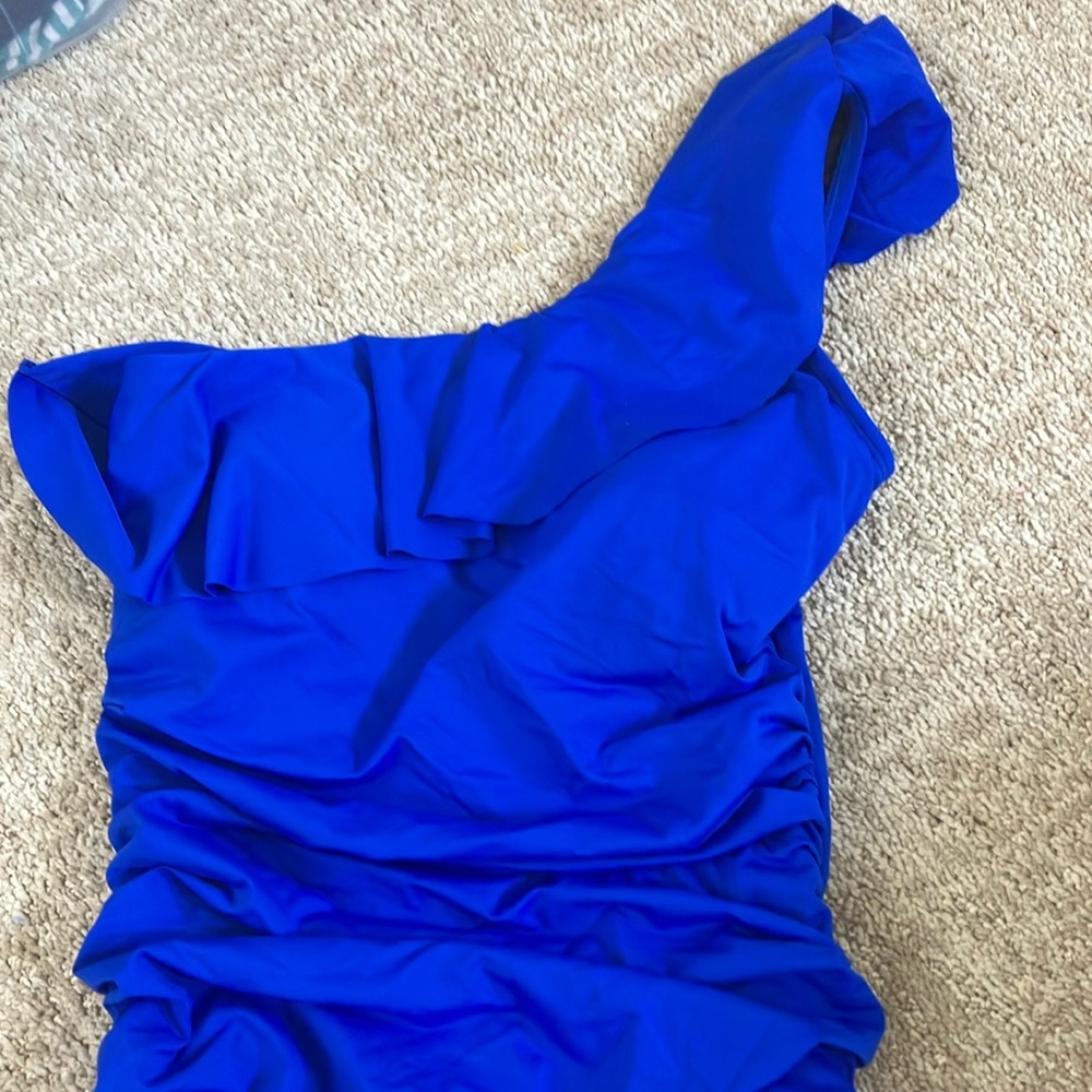 Blue aymeteical ruffle top one piece 8